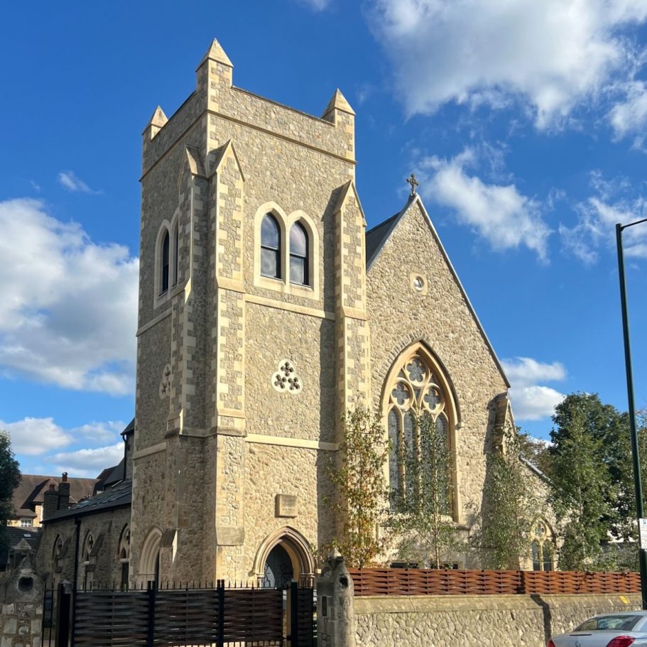 Stained glass windows featuring figures and vibrant floral designs.