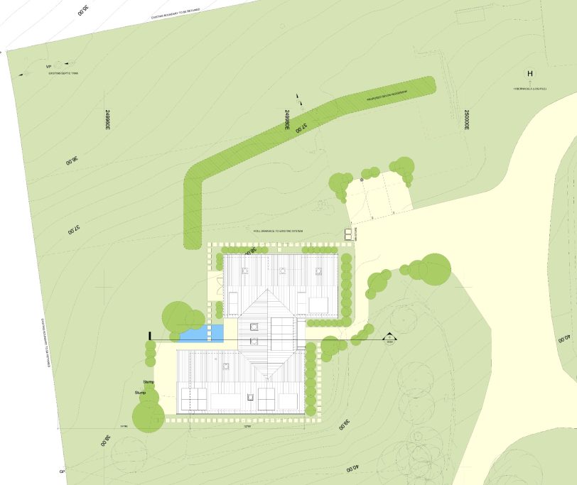 Site plan showing a building layout, parking area, gardens, and pathways.